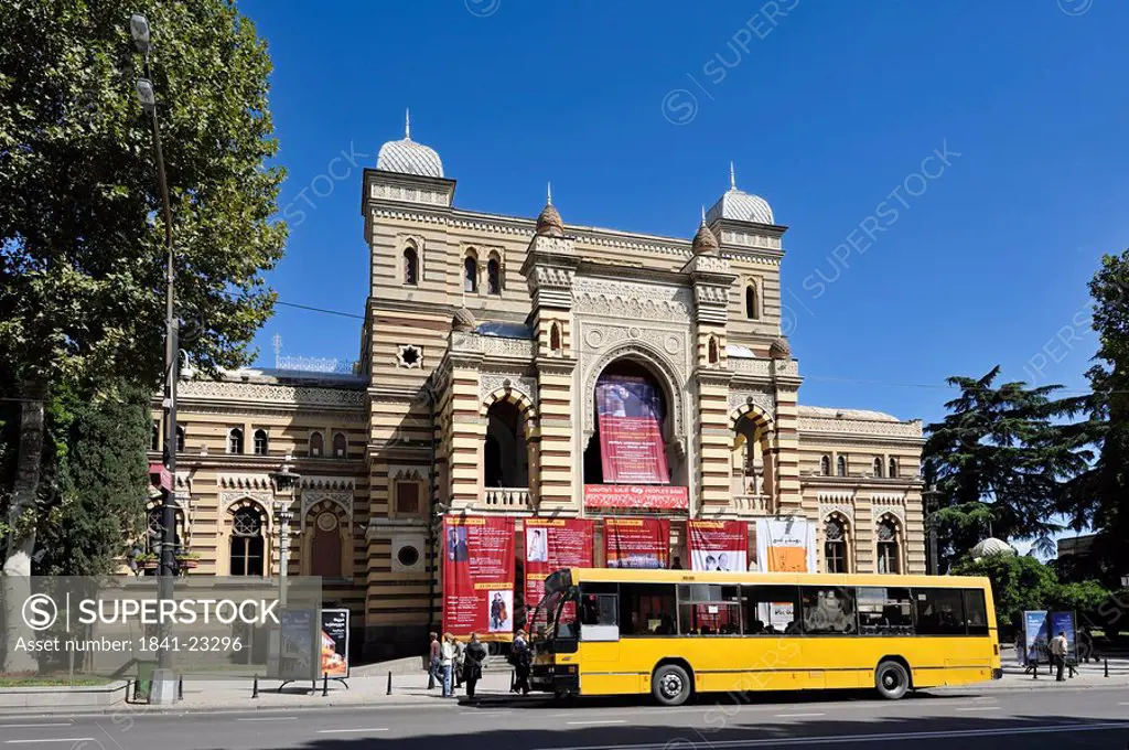 Bus in front of a theatre building in Tbilisi, Georgia