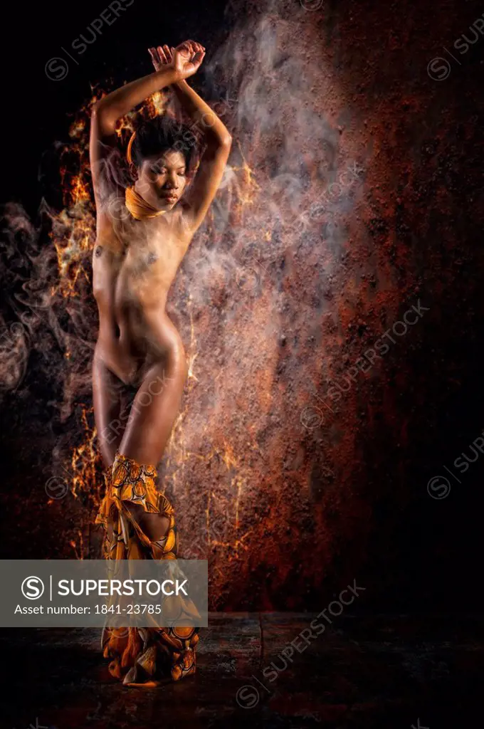 Naked young woman dancing