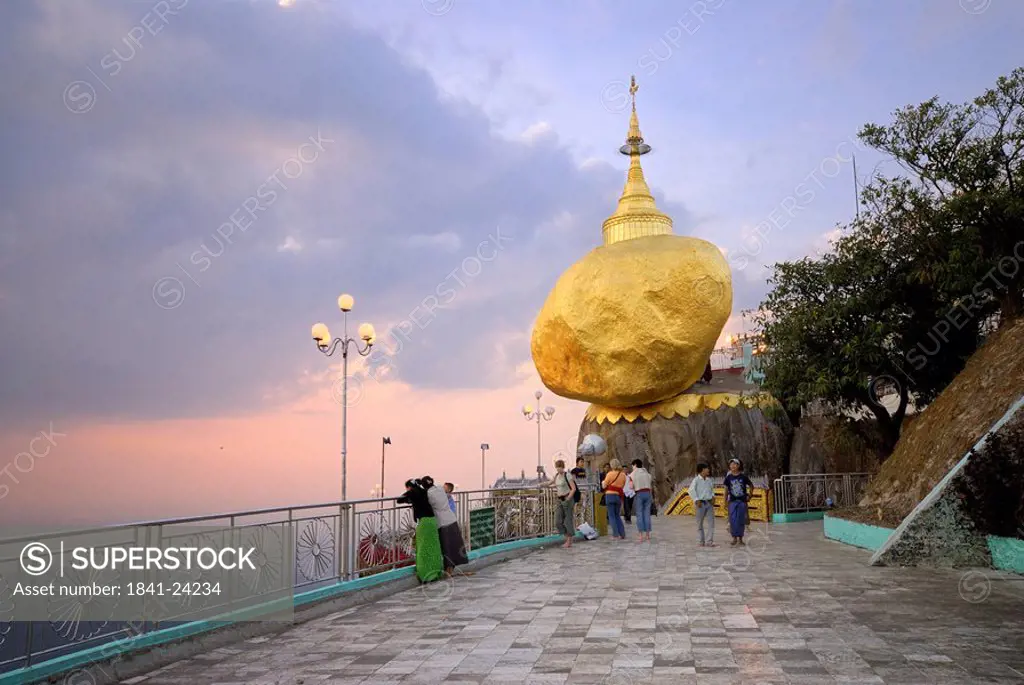 Pilgrims near pagoda on golden rock, Kyaiktiyo Pagoda, Mon State, Myanmar