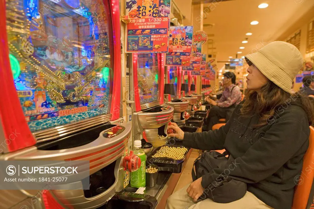 People playing video games on Pachinko, Japan