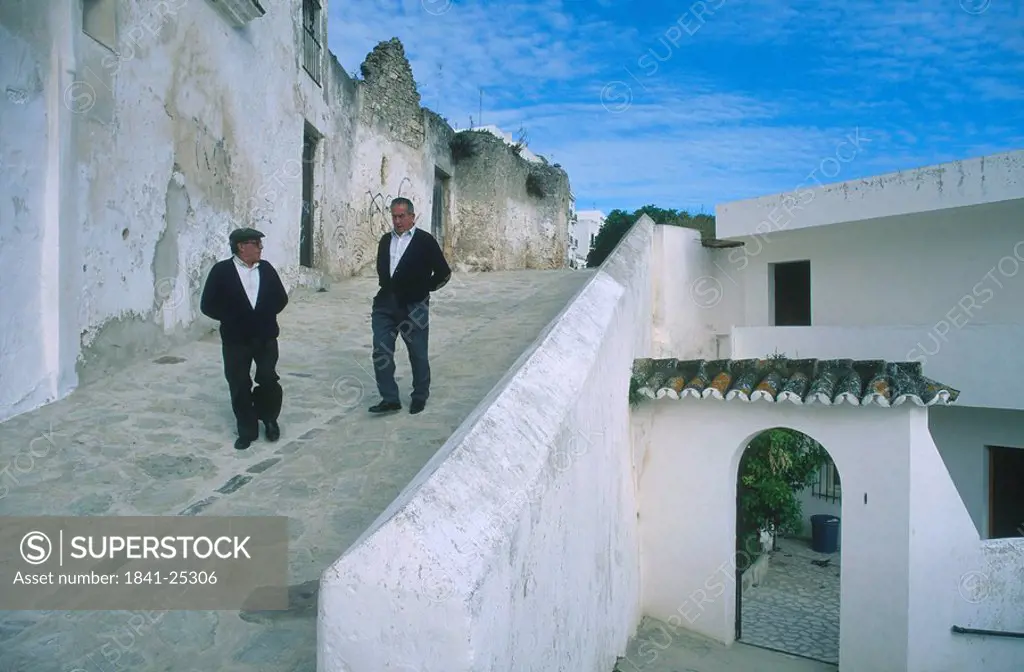 Two men at white houses, Vejer de la Frontera, Andalusia, Spain
