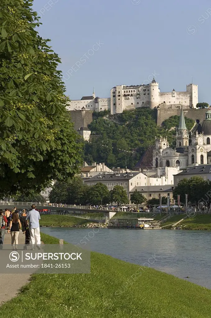 Tourists near river, Salzach River, Salzburg, Austria