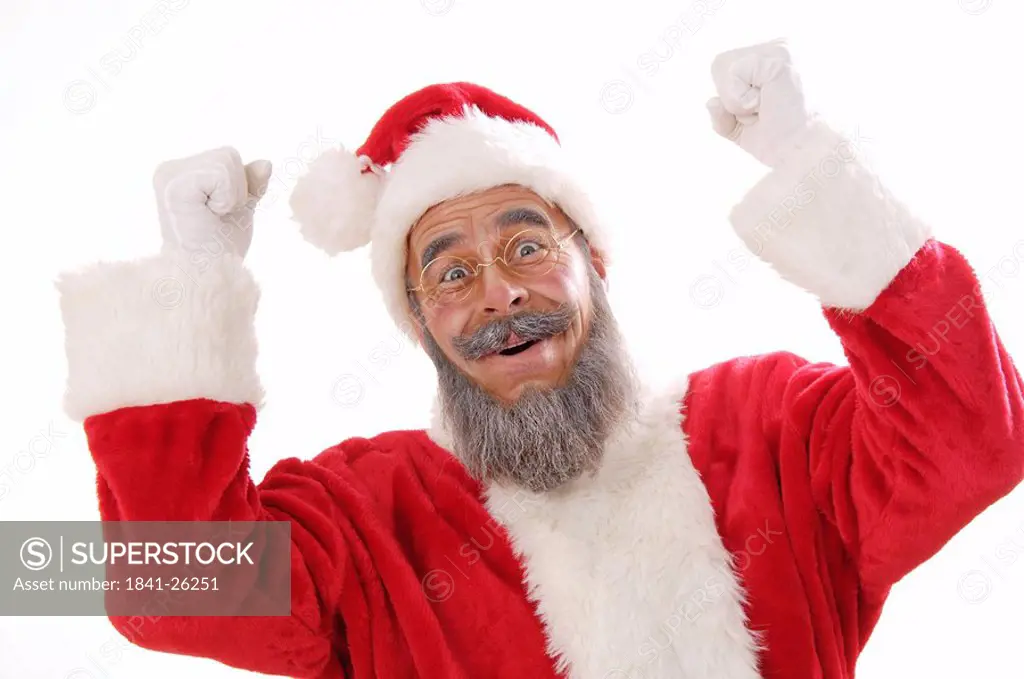 Portrait of senior man in santa costume looking joyous