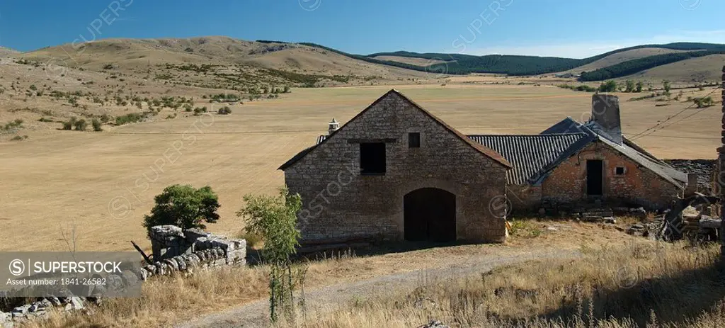 Farmhouses on landscape, Causse Mejean, Auvergne, France