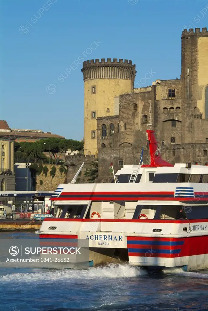 Castle at waterfront viewed from ferry port, Castel Nuovo, Naples, Campania, Italy