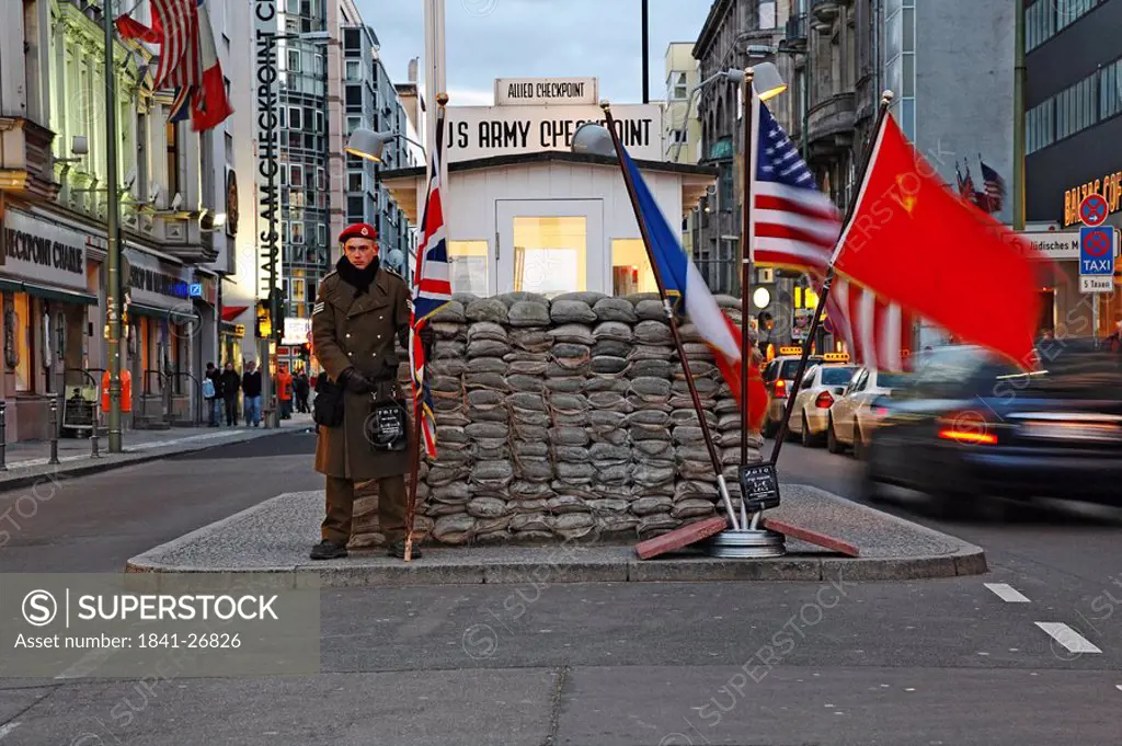 Policeman standing at checkpoint, Checkpoint Charlie, Berlin, Germany