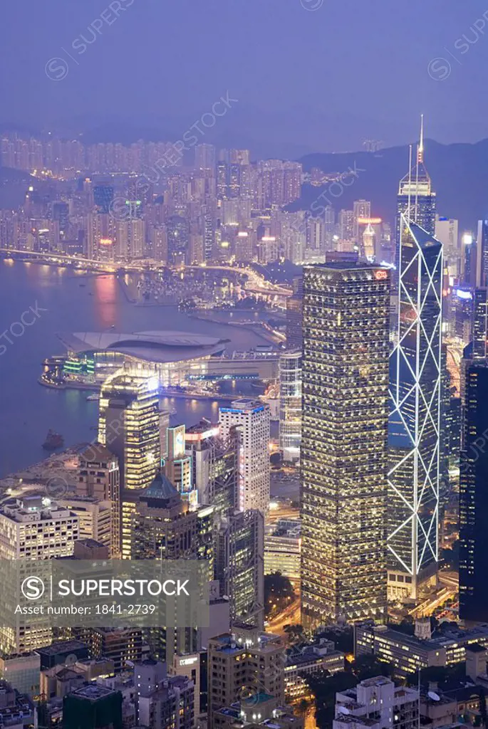 City lit up at waterfront, Hong Kong, China