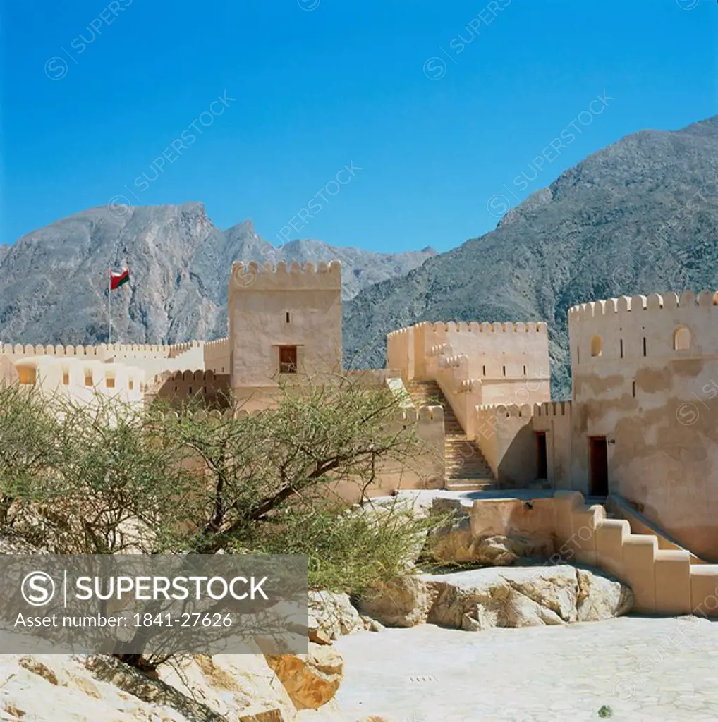 Castle in front of mountains, Nakhl Fort, Al Batinah, Oman