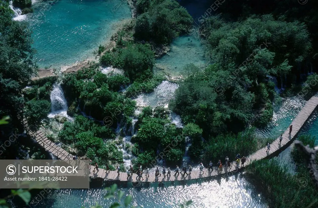 High angle view of tourists walking on footbridge, Plitvice Lakes National Park, Croatia