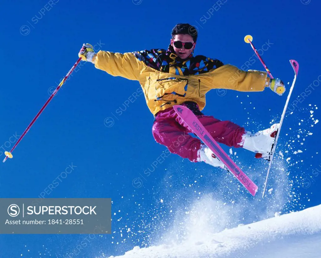 Low angle view of young man skiing