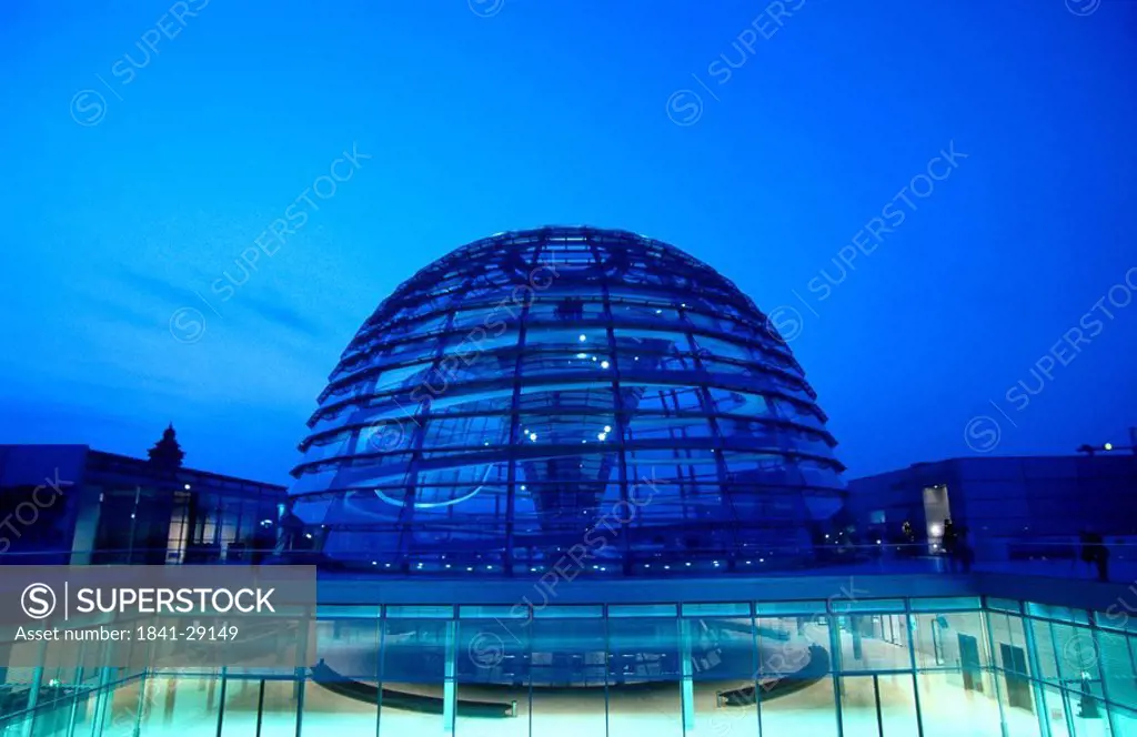 Glass building lit up at night, The Reichstag, Berlin, Germany