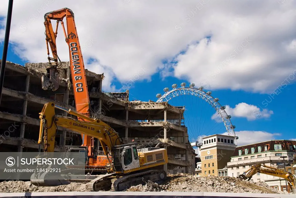 Building under construction with ferris wheel in background, Millennium Wheel, London, England