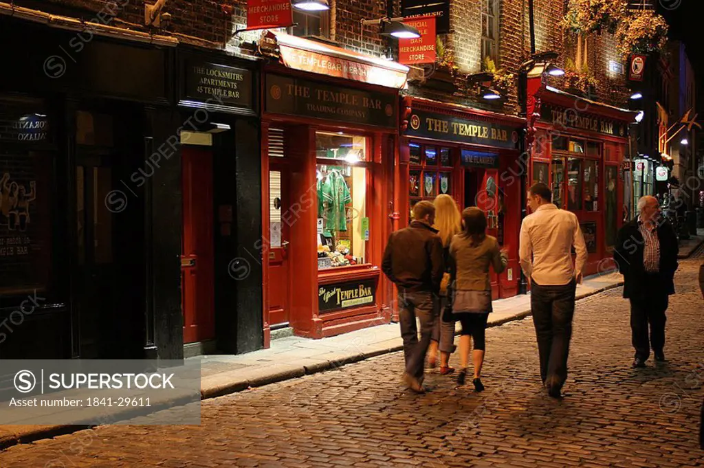 People walking in street in front of bar, Dublin, Republic of Ireland