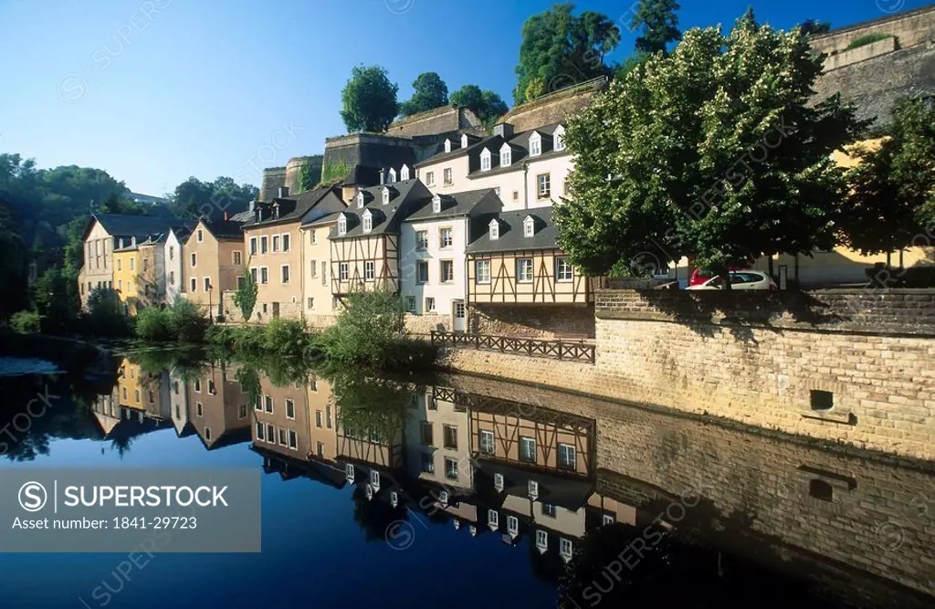 Reflection of houses in water, Alzette River, Luxembourg City, Luxembourg