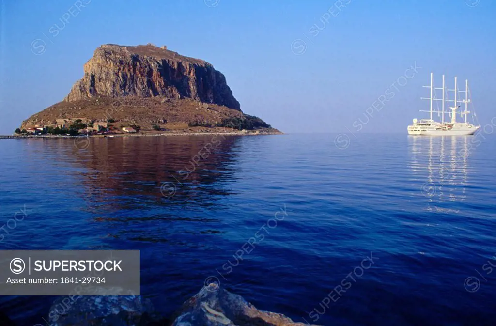 Boat moored near an island, Monemvassia, Peloponnese, Greece