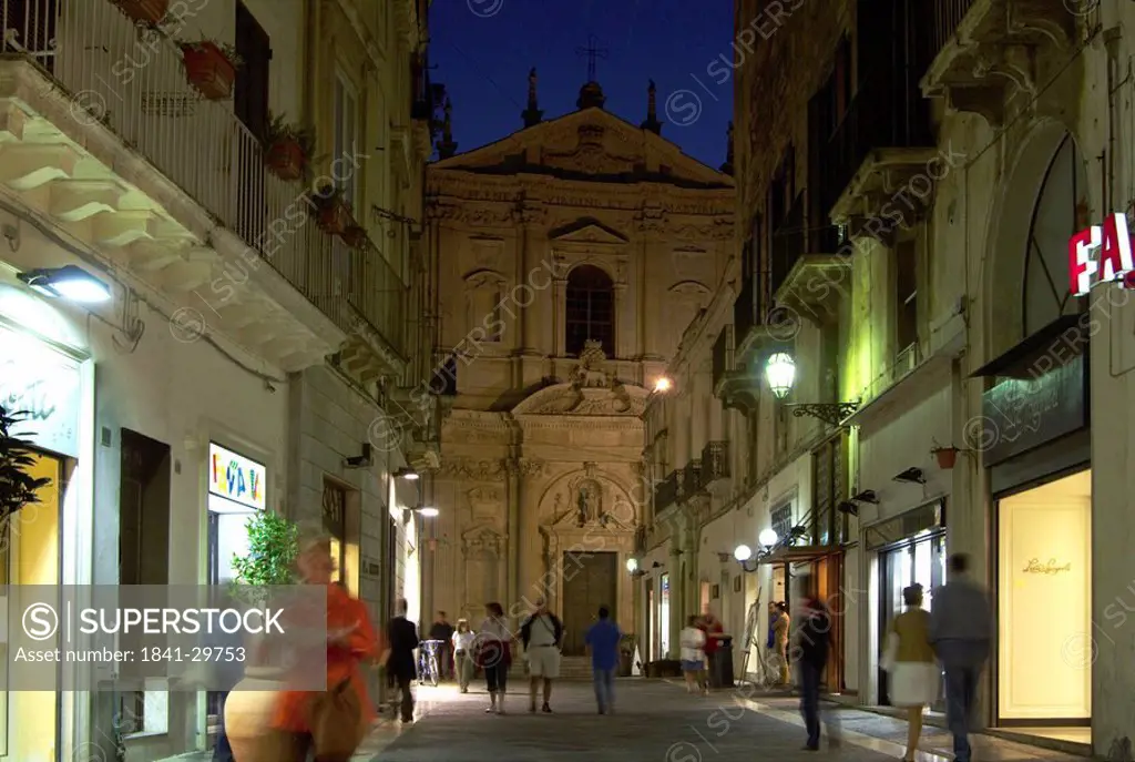 Tourists near church at night, Basilica Di Santa Croce, Lecce, Apulia, Italy