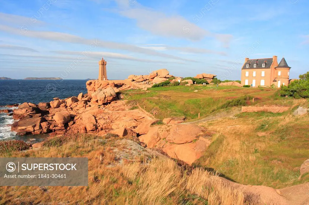Lighthouse and house at coast, Ploumanac´h, Cote de Granite Rose, Cote d´Armor, Brittany, France
