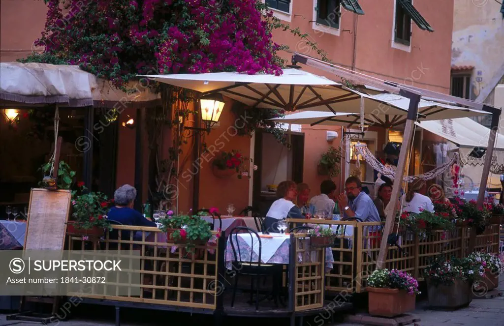 Tourists at outdoor cafe, Porto Azzurro, Elba, Italy