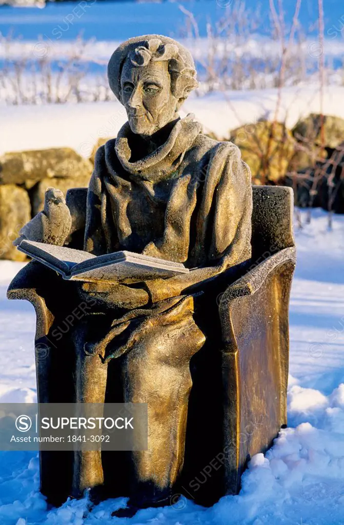 Sculpture of person reading book, Stockholm, Sweden