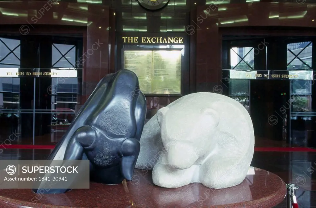 Bear and bull sculptures in stock exchange building, Singapore