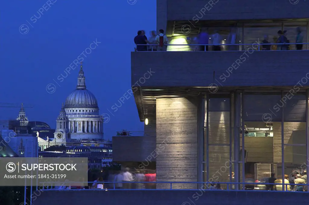 Buildings in city at dusk, St Pauls Cathedral, National Theatre, London, England