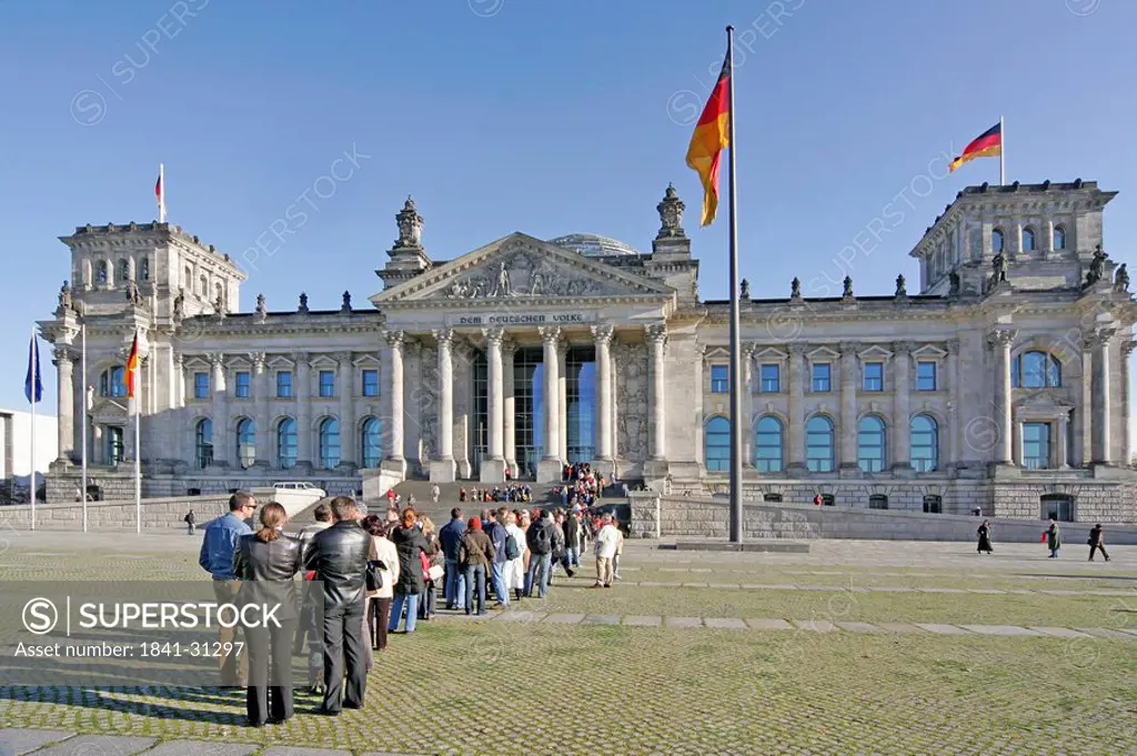 Line of people in front of the Reichstag building, Berlin, Germany