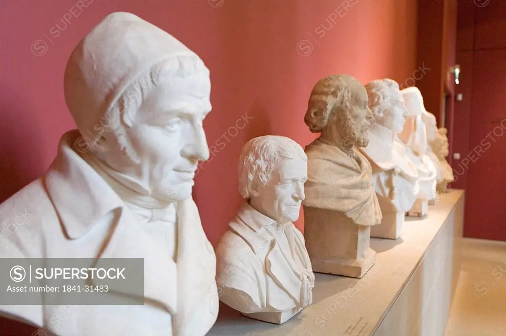 Side profile of statues in row