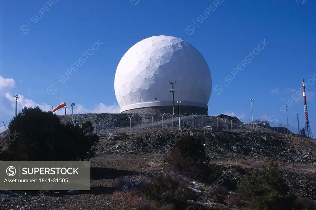 Radar station on hill against blue sky, Trodos Mountains, Cyprus