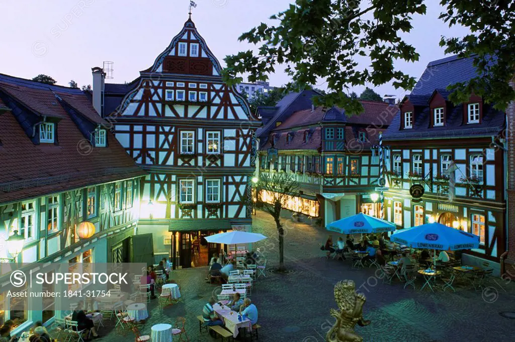 High angle view of people in coffee shop at dusk, Idstein, Darmstadt, Hesse, Germany