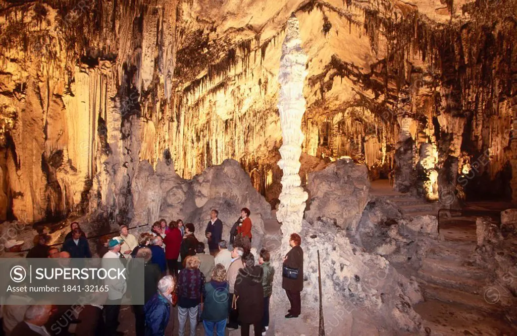 Tourists inside a limestone cave, Coves d Arta, Canary Islands, Spain