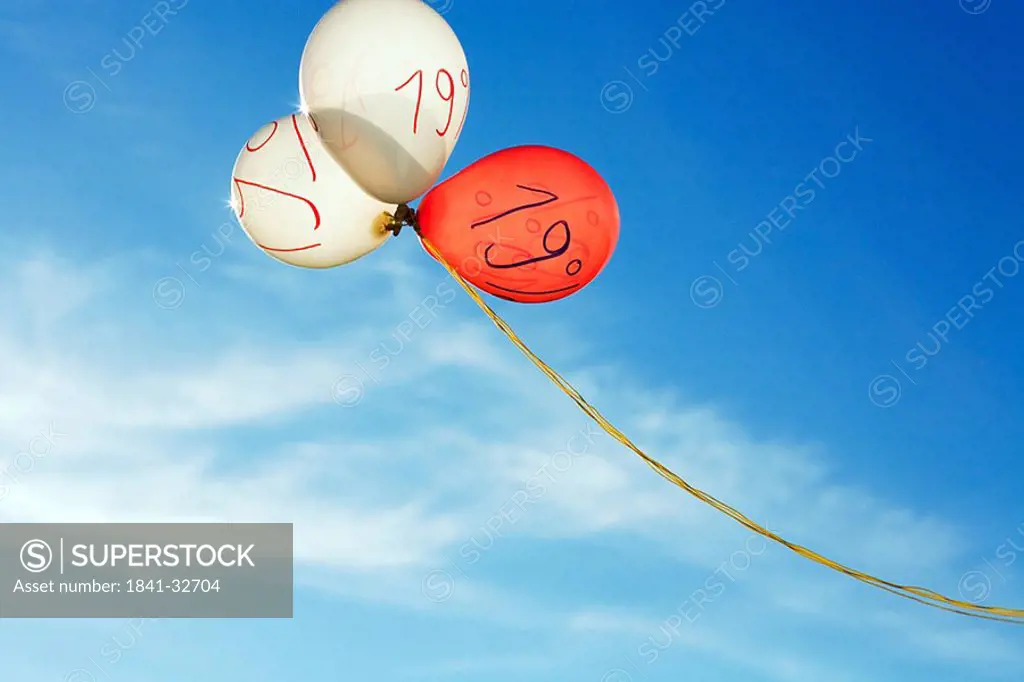 Low angle view of balloons with nineteen percent written
