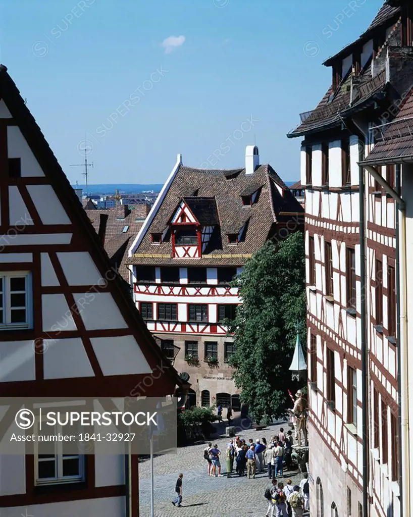 High angle view of tourists near timber framed house, Albrecht Duerer House Museum, Nueremberg, Germany