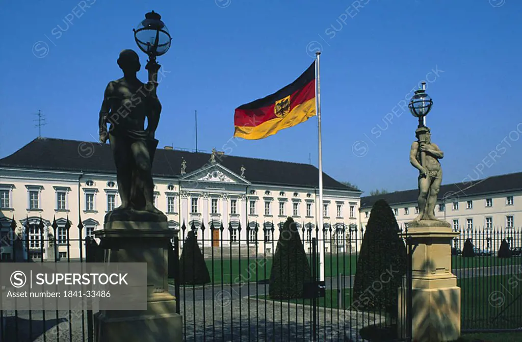 German flag in front of building, Berlin, Germany