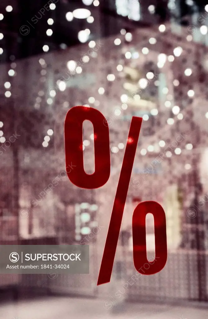Close_up of percentage sign on window glass