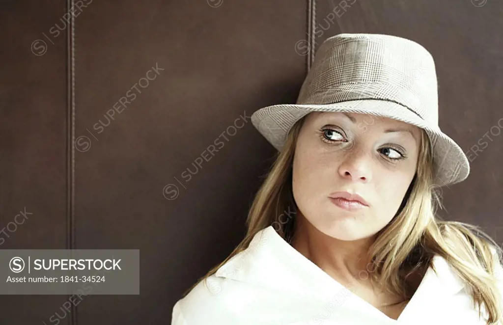 Close_up of young woman glancing sideways
