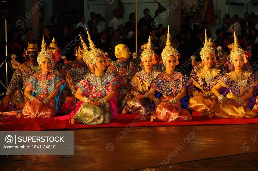 Traditional dancers performing dance based on Hindu epic Ramayana, Wat Trimitr, Bangkok, Thailand