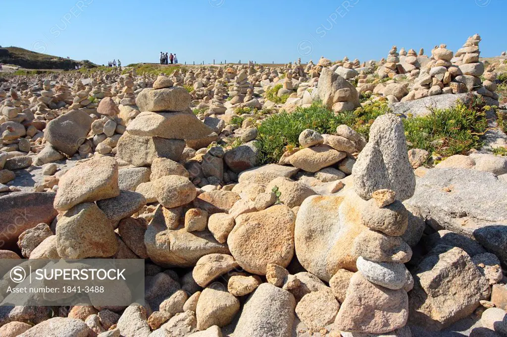 Rock formations on landscape, Pointe de la Torche, Finistere, Brittany, France