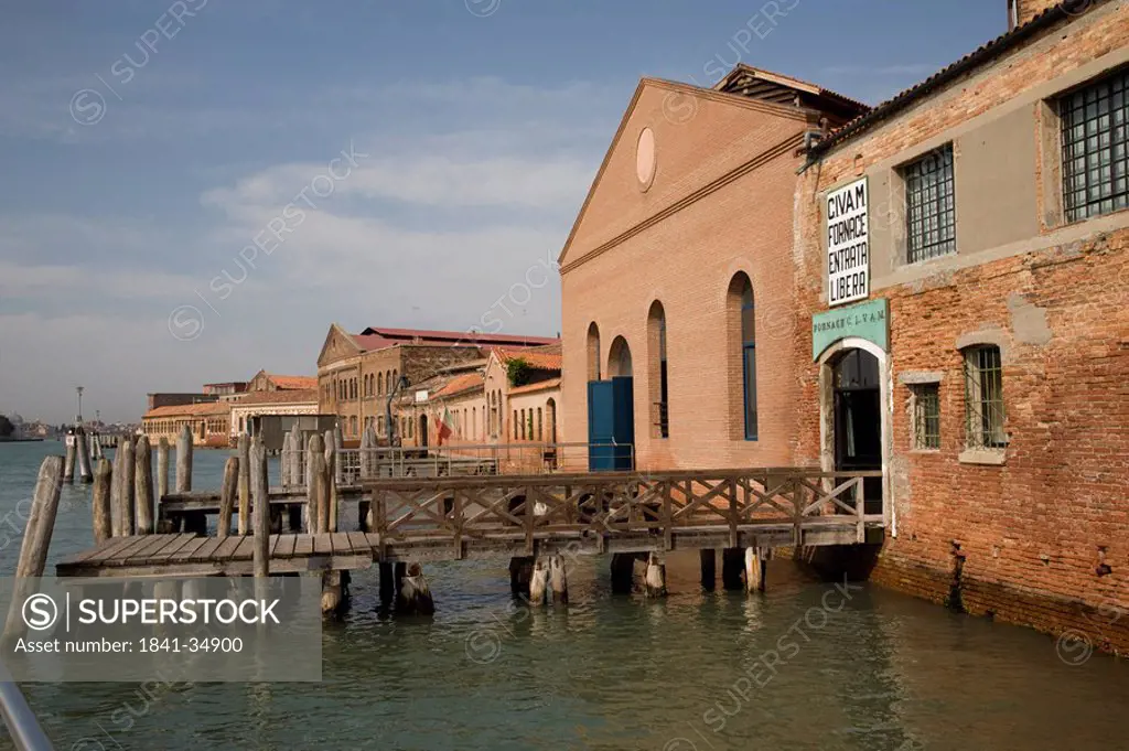 Wooden pier leading to factory, Grand Canal, Isola Murano, Veneto, Venice, Italy