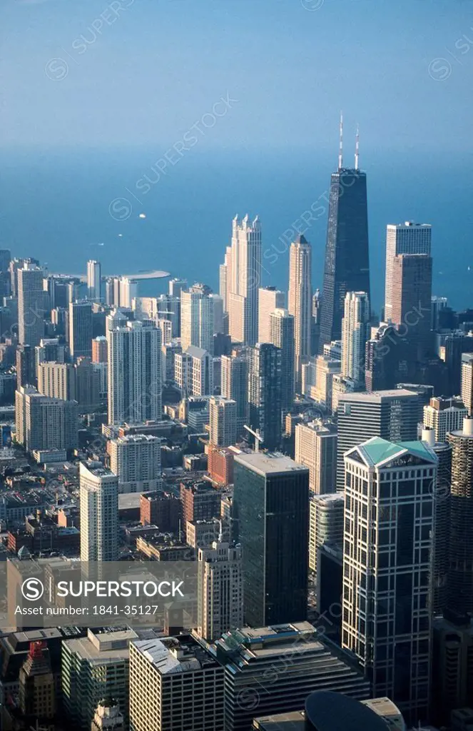 Skyscrapers in city with lake in background viewed from Sears Tower, John Hancock Center, Lake Michigan, Chicago, Illinois, USA