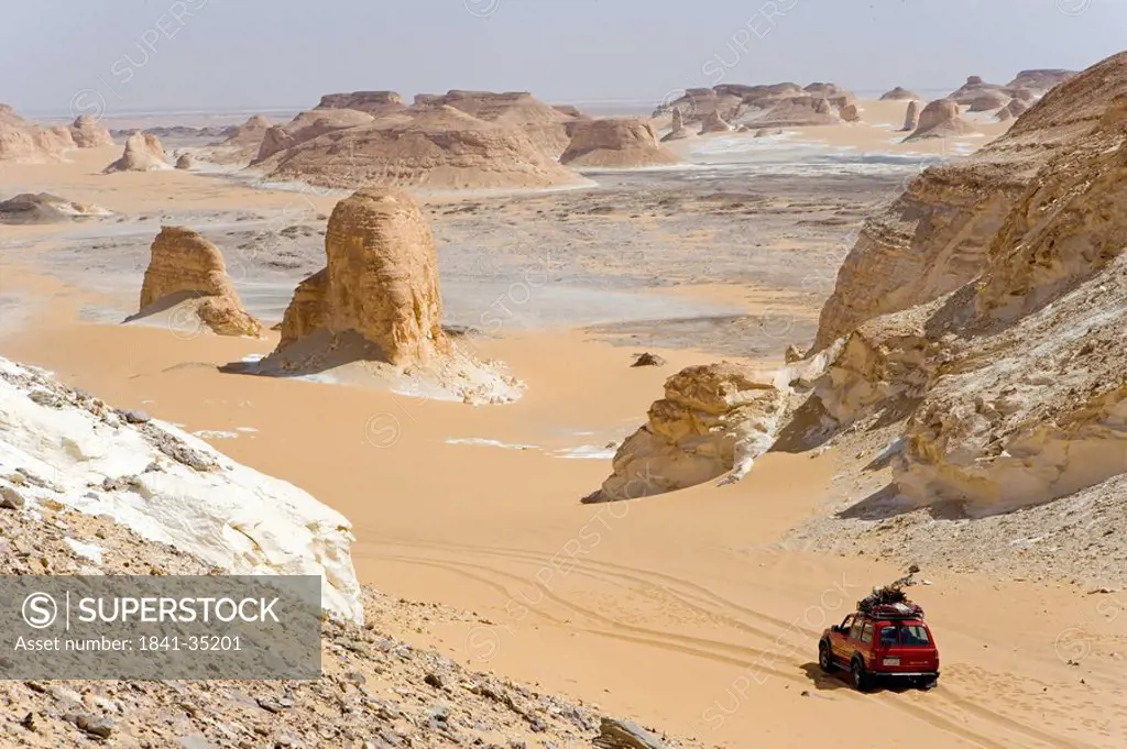 High angle view of car in arid landscape, Farafra Oasis, Libyan Desert, Egypt
