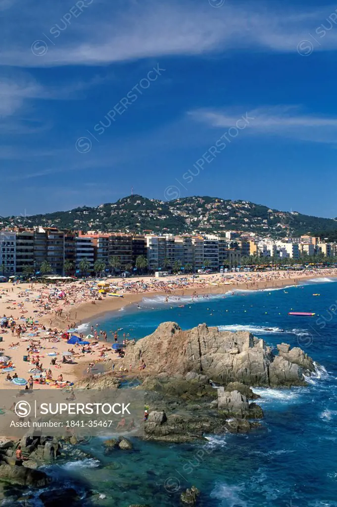 Tourists on beach, Lloret de Mar, Girona Province, Catalonia, Spain