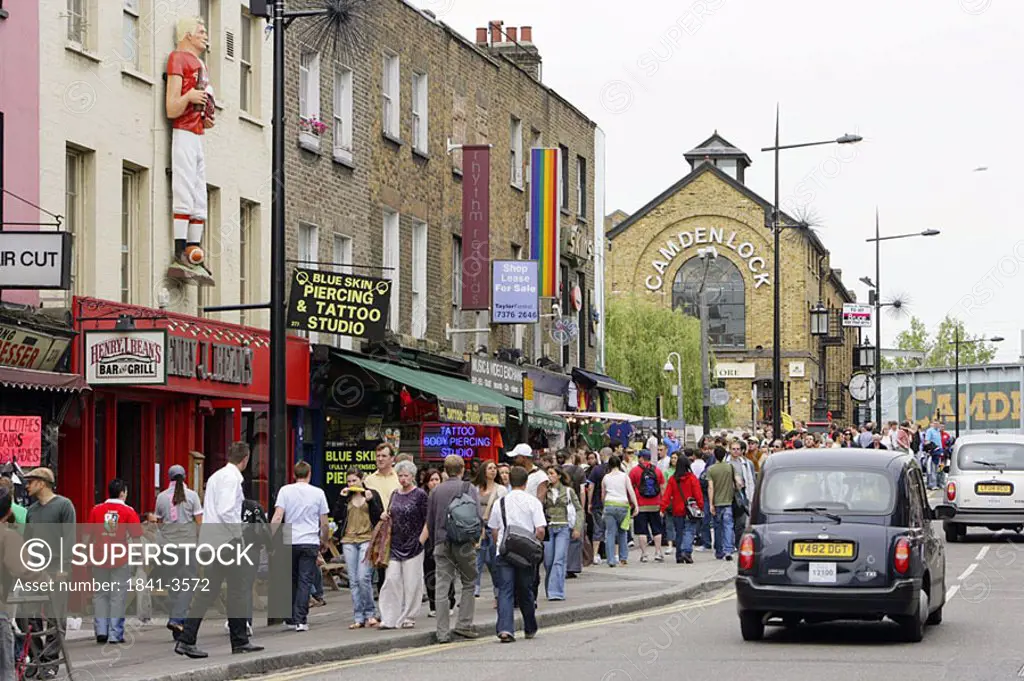 People walking on sidewalk, Camden, London, England