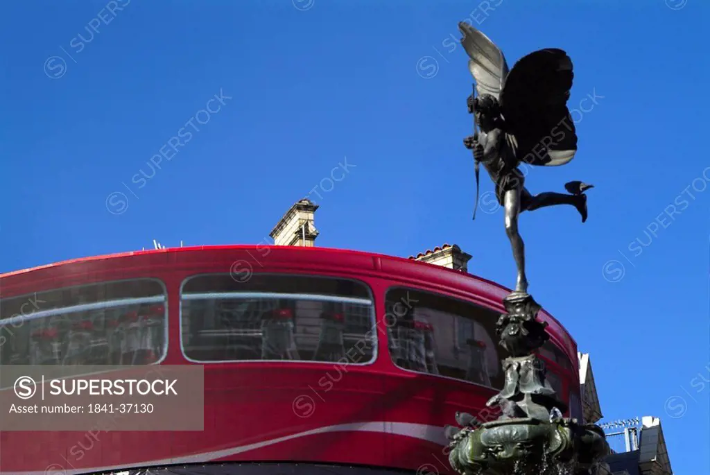 Eros statue against blue sky, Piccadilly Circus, London, England