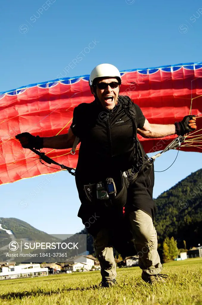 Paraglider running to takeoff