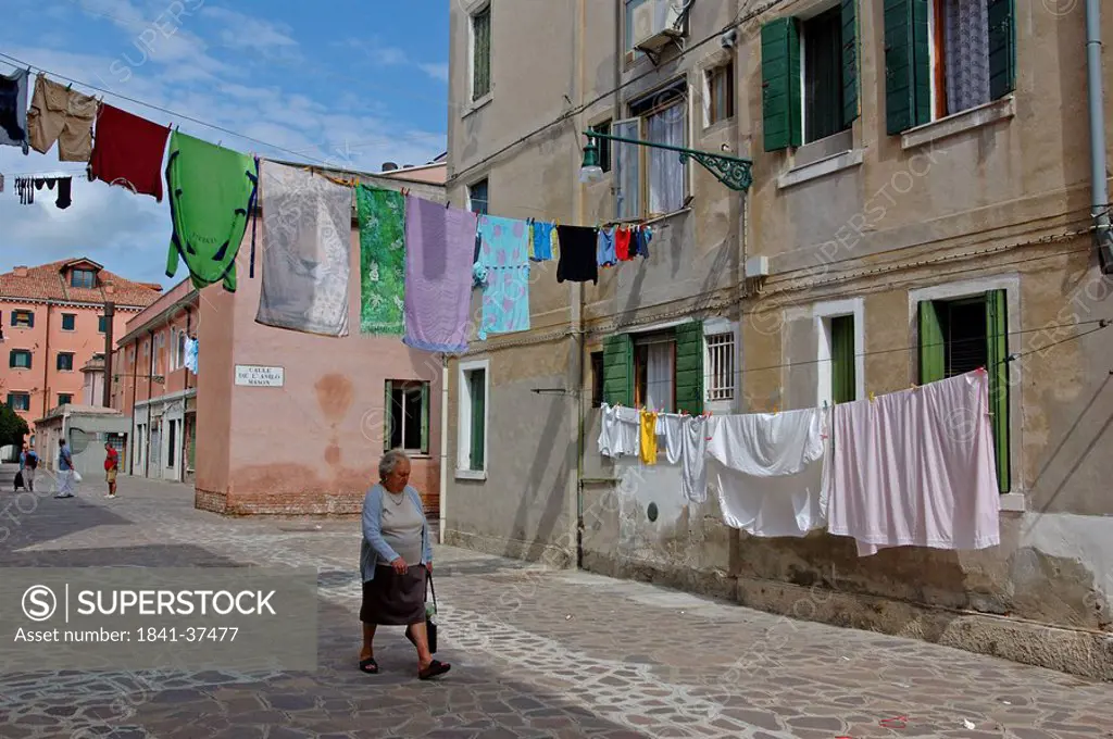 Laundry drying on clotheslines in an alley, Giudecca, Venice, Italy