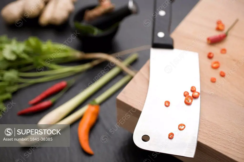 Chopped red chilli peppers on meat cleaver