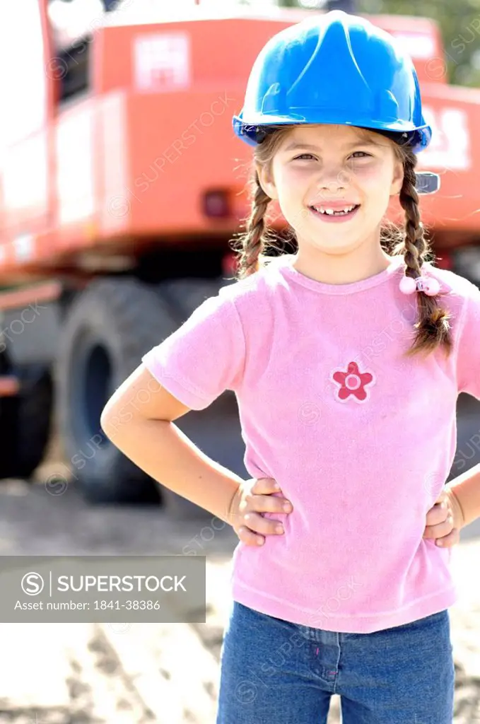 Portrait of girl wearing hardhat and smiling