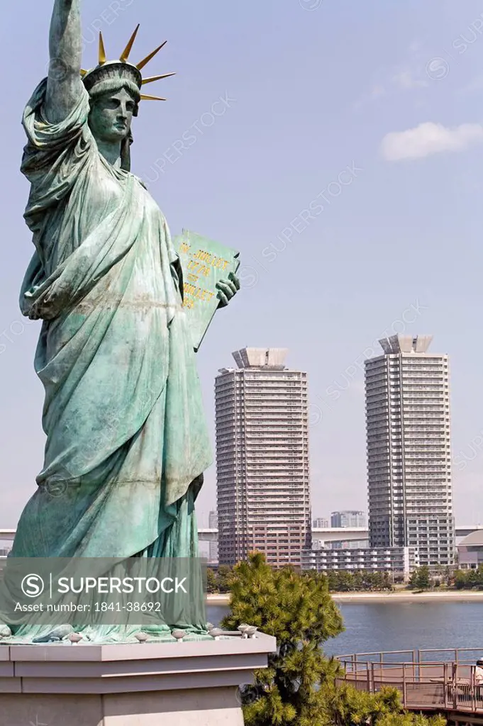 Statue of Liberty replica, skyscrapers in the background, Tokyo, Japan