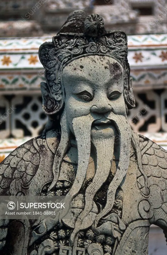 Close_up of chinese figure, Wat Arun, Bangkok, Thailand