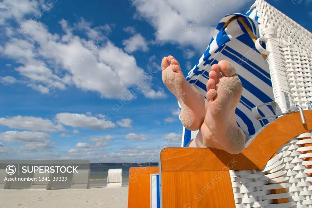 Feet in beach chair, Gluecksburg, Schleswig_Holstein, Germany